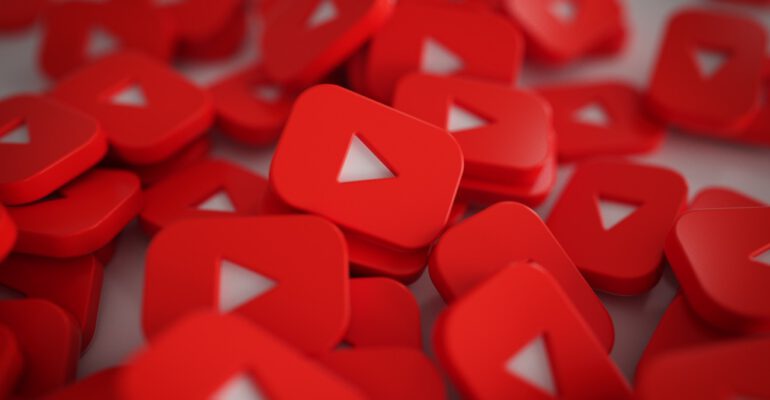 Pile of 3D Play Button Logos